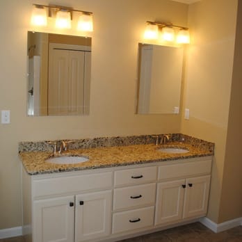 Instock Flooring - a bathroom with two sinks and two mirrors - Flooring Near Me - Salem, New Hampshire