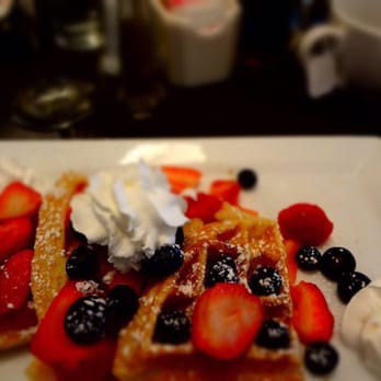 Syrup Downtown - Mini waffle flight with strawberries and blueberries topped with whipped cream! - Breakfast & Brunch Near Me - Denver, Colorado Syrup Downtown - Mini waffle flight with strawberries and blueberries topped with whipped cream! - Breakfast & Brunch Near Me - Denver, Colorado