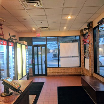 Lou Malnati's Pizzeria - Interior - clean and minimalist with cute little chairs hung on the walls - Pizza Near Me - Bloomingdale, Illinois Lou Malnati's Pizzeria - Interior - clean and minimalist with cute little chairs hung on the walls - Pizza Near Me - Bloomingdale, Illinois