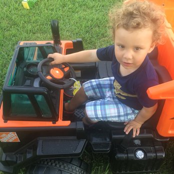 GK Building Group - a toddler playing in a toy tractor - General Contractors Near Me - Cutler Bay, Florida GK Building Group - a toddler playing in a toy tractor - General Contractors Near Me - Cutler Bay, Florida