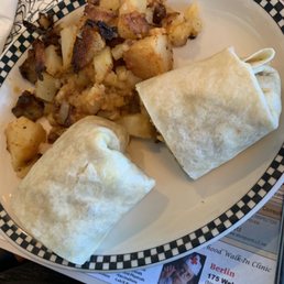 Breakfast burrito yumminess. The hot sauce was already on the table. :) Breakfast burrito yumminess. The hot sauce was already on the table. :)