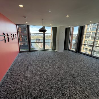Prestige Interiors - an empty office with a view of the city - Flooring Near Me Prestige Interiors - an empty office with a view of the city - Flooring Near Me