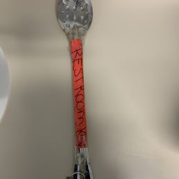 Filthy ladle bathroom key in the waiting room of the surgical center. Filthy ladle bathroom key in the waiting room of the surgical center.