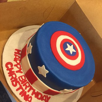 Oh, What A Cake! - Round, marble cake with fondant design, and buttercream frosting. The blue is frosting which they smoothed over perfectly!! - Bakeries Near Me - Columbia, Maryland