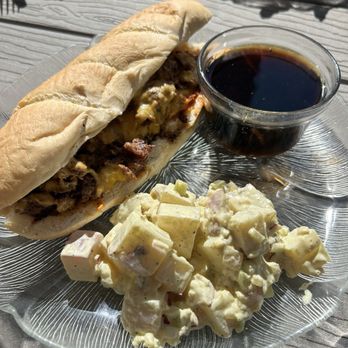 Chalkboard Cafe - French Cousin with cheddar cheese and red potato salad as a side. - Breakfast & Brunch Near Me - Seaside, Oregon