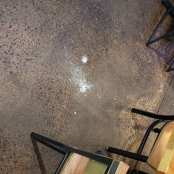 City Barbeque - a table and chairs with a broken glass on the floor - Barbeque Near Me - Suwanee, Georgia