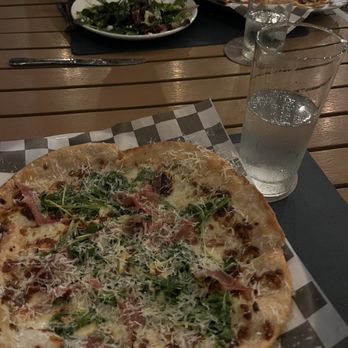 Range - Pizza with multiple types of white cheese, prosciutto, and arugula. The crust was thin and crispy. - Steakhouses Near Me - San Antonio, Texas