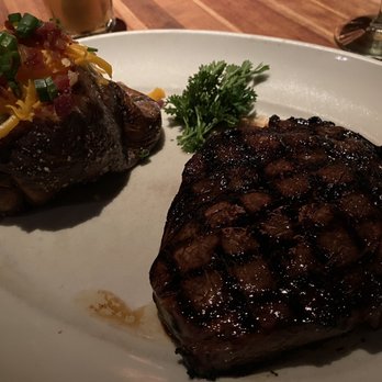 Houston's Restaurant - Hawaiian Rib Eye (medium rare) with loaded baked potato - Steakhouses Near Me - Pasadena, California