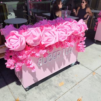 TOMO Tea House - Outdoor seating and pink planter boxes with large foam roses and cherry blossoms. - Coffee & Tea Near Me - Palo Alto, California TOMO Tea House - Outdoor seating and pink planter boxes with large foam roses and cherry blossoms. - Coffee & Tea Near Me - Palo Alto, California