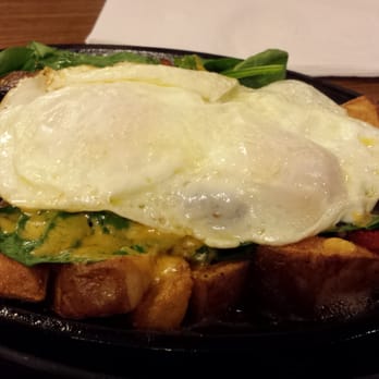Denny's - Ultimate skillet: eggs, sausage, potatoes, onions frying on a hot skillet. - American Near Me - Chula Vista, California