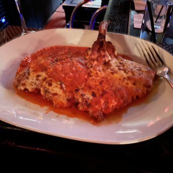 Piero's Italian Cuisine - Veal butterfly chopped parmigiana - Italian Near Me - Las Vegas, Nevada Piero's Italian Cuisine - Veal butterfly chopped parmigiana - Italian Near Me - Las Vegas, Nevada