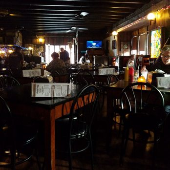 Moody's Pub - Tables are literally on top of each other.  Because it was so bright outside, it was really light in here, relatively speaking - Pubs Near Me - Chicago, Illinois