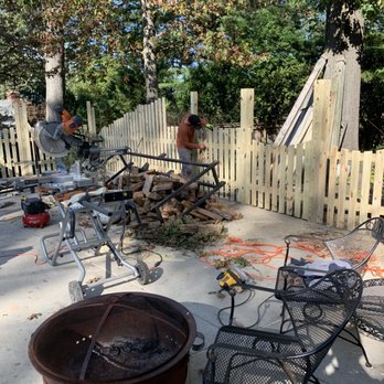 Cortes Landscape - a group of people around a fire pit - Landscaping Near Me - Alexandria, Virginia