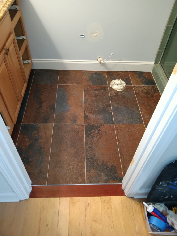 Slide of Bathmatic Custom Tile and Shower