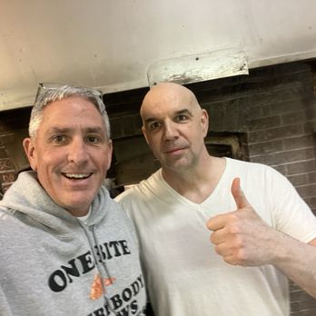 Little Rendezvous - Owner in front of the 130 year old oven. - Pizza Near Me - Meriden, Connecticut