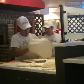 Juliana's - making the crust - Pizza Near Me - Brooklyn, New York
