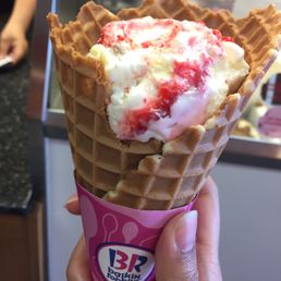 Single Scoop Strawberry Cheesecake in a Waffle Cone. Single Scoop Strawberry Cheesecake in a Waffle Cone.