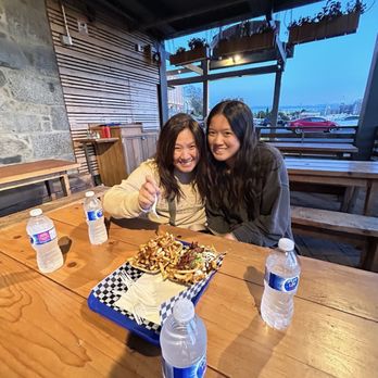 L'Authentique Poutine and Burgers - Eating poutine on their outdoor patio - Burgers Near Me - Victoria, British Columbia L'Authentique Poutine and Burgers - Eating poutine on their outdoor patio - Burgers Near Me - Victoria, British Columbia