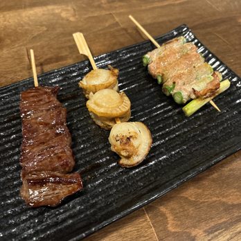 Izakaya Takasei - Prime Beef (left), Butter Soy Scallop (middle), and Bacon Asparagus (right) Skewers - Japanese Near Me - Huntington Beach, California Izakaya Takasei - Prime Beef (left), Butter Soy Scallop (middle), and Bacon Asparagus (right) Skewers - Japanese Near Me - Huntington Beach, California