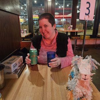 Centro - She is holding her Tepache and crisp cold water - Tacos Near Me - Saint Paul, Minnesota Centro - She is holding her Tepache and crisp cold water - Tacos Near Me - Saint Paul, Minnesota