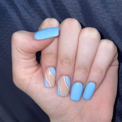 Mini Sky Nails - Short blue acrylic nails with a squiggly pattern on two nails