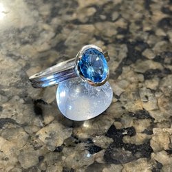 The Goldsmith Shoppe - Aqua marine reset in a euro- silver band