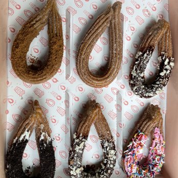 Lola's Handcrafted Churros - Top: Cookie butter, cinnamon sugar, chocolate almond Bottom: Cookies & cream, chocolate almond, pink chocolate & sprinkles - Desserts Near Me - Lisle, Illinois Lola's Handcrafted Churros - Top: Cookie butter, cinnamon sugar, chocolate almond Bottom: Cookies & cream, chocolate almond, pink chocolate & sprinkles - Desserts Near Me - Lisle, Illinois