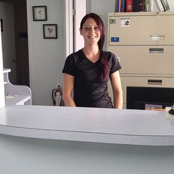Reflections Therapeutic Massage - Therapist Nicole at reception
