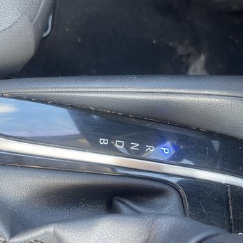 Enterprise Rent-A-Car - Dirt on the gear shift area and worn down grey drivers side floor. - Car Rental Near Me - Toms River, New Jersey