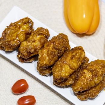 Chi+Mac - a plate of chicken nuggies with tomatoes and peppers - Chicken Wings Near Me - El Centro, California Chi+Mac - a plate of chicken nuggies with tomatoes and peppers - Chicken Wings Near Me - El Centro, California