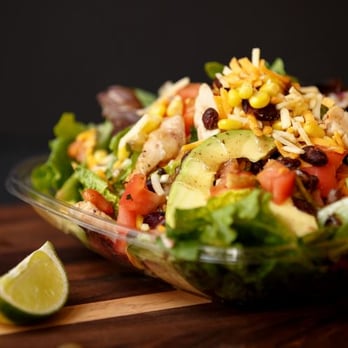 Freshii - a salad in a bowl on a cutting board - Salad Near Me - Mississauga, Ontario Freshii - a salad in a bowl on a cutting board - Salad Near Me - Mississauga, Ontario