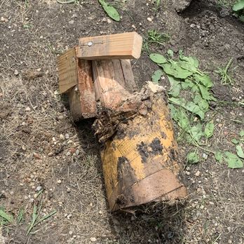MLM Remodeling - Posts are to be attached to the top of the concrete not in it. It causes rot. I pulled this post out by hand. It was only 12" deep. - Flooring Near Me - Plano, Illinois