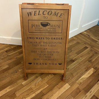 Perk On Main - Welcome sign at entrance near barista area. - Creperies Near Me - Middletown, Connecticut