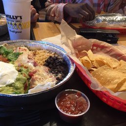Baja Burrito with chips, guac AND queso what what