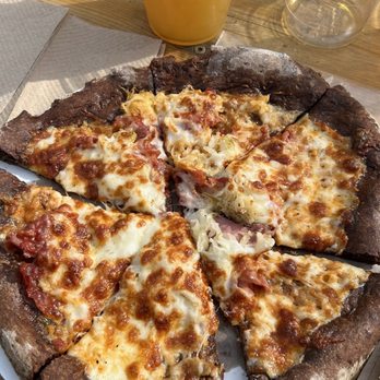 The Brick Oven Bus - Rueben pizza pairs with w an IPA from Back Channel Brewing! - Food Trucks Near Me