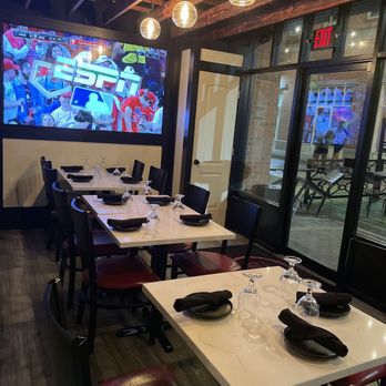 Vinas Wine & Tapas - a restaurant with a large screen - Tapas Bars Near Me - New Haven, Connecticut Vinas Wine & Tapas - a restaurant with a large screen - Tapas Bars Near Me - New Haven, Connecticut