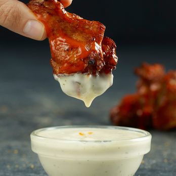 Papa Johns Pizza - a hand dipping a piece of bacon - Pizza Near Me - Hanover, Pennsylvania Papa Johns Pizza - a hand dipping a piece of bacon - Pizza Near Me - Hanover, Pennsylvania