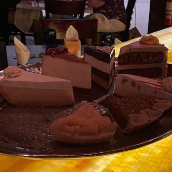 Texas de Brazil - Image of dessert options. There is no menu at the table, they just bring out this plate. - Brazilian Near Me - Schaumburg, Illinois