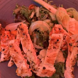 Tuscan chicken salad. Looks pink because it's under a red umbrella!