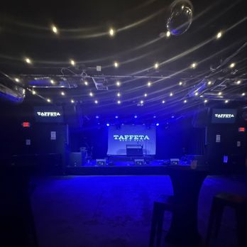 Taffeta Music Hall - Stage area with two chair high tops - Music Venues Near Me - Lowell, Massachusetts