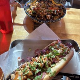 The foot long Sonoran Hot Dog and chicken rice bowl. The foot long Sonoran Hot Dog and chicken rice bowl.