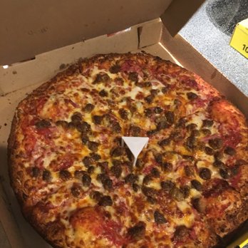 Hungry Howie's Pizza & Subs - Meat with Cajun crust. The seasoning gives the appearance of it being over cooked but it was cooked just right. - Italian Near Me - Vero Beach, Florida