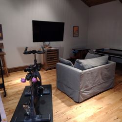 Just Call Sarah Cleaning Services - Family room all tidied and clean. Exercise bike all wiped down as well.
