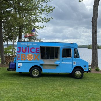 The Winni Juice Box - a blue food truck parked in front of a lake - Juice Bars & Smoothies Near Me - Meredith, New Hampshire The Winni Juice Box - a blue food truck parked in front of a lake - Juice Bars & Smoothies Near Me - Meredith, New Hampshire