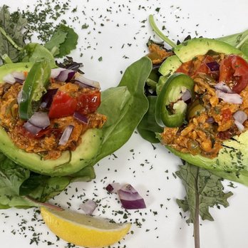 Caliente’s - Stuffed Avocado with wild caught Sockeye Salmon Ragu - Seafood Near Me - The Bronx, New York