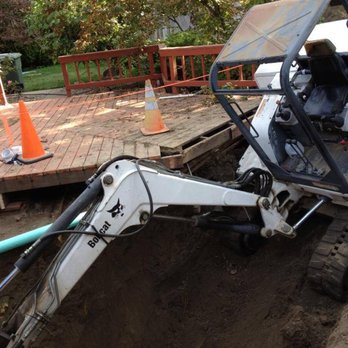 Quality Backhoe Services - Excavating in a backyard for a sewer service repair in Richland, WA - Excavation Services Near Me
