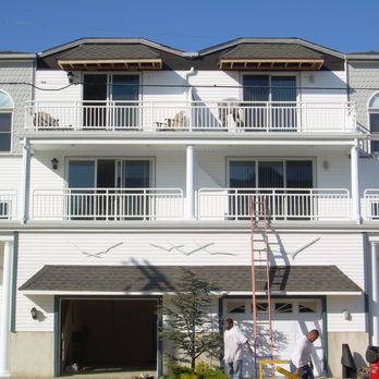 Saviors Custom Carpentry - a white house with balconies - Carpenters Near Me - Hamilton, New Jersey Saviors Custom Carpentry - a white house with balconies - Carpenters Near Me - Hamilton, New Jersey