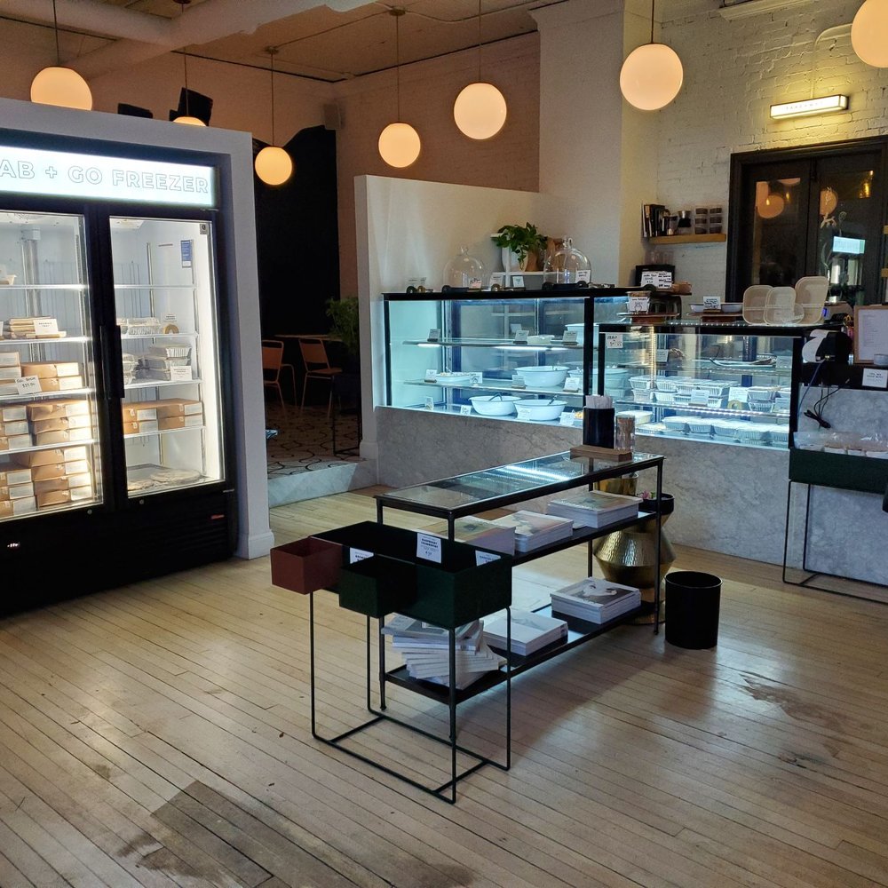 Moveable Feast - a woman standing in front of a display case - Cafes Near Me - Wheaton, Illinois Moveable Feast - a woman standing in front of a display case - Cafes Near Me - Wheaton, Illinois