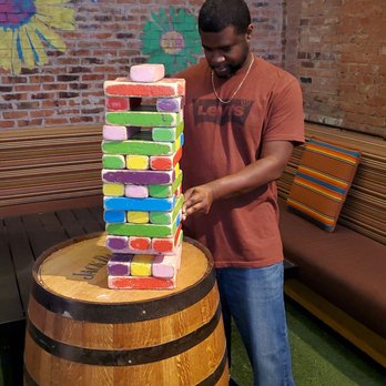 Backyard - Dallas - Playing Jenga!! - New American Near Me - Dallas, Texas