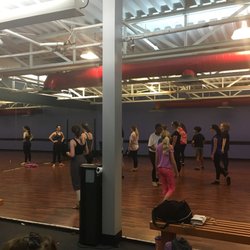 Dancers Center for Training - A mirror at the front of the room and a decent size dancing area for students.